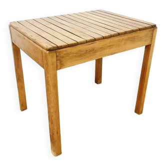 Small wooden slatted dining table