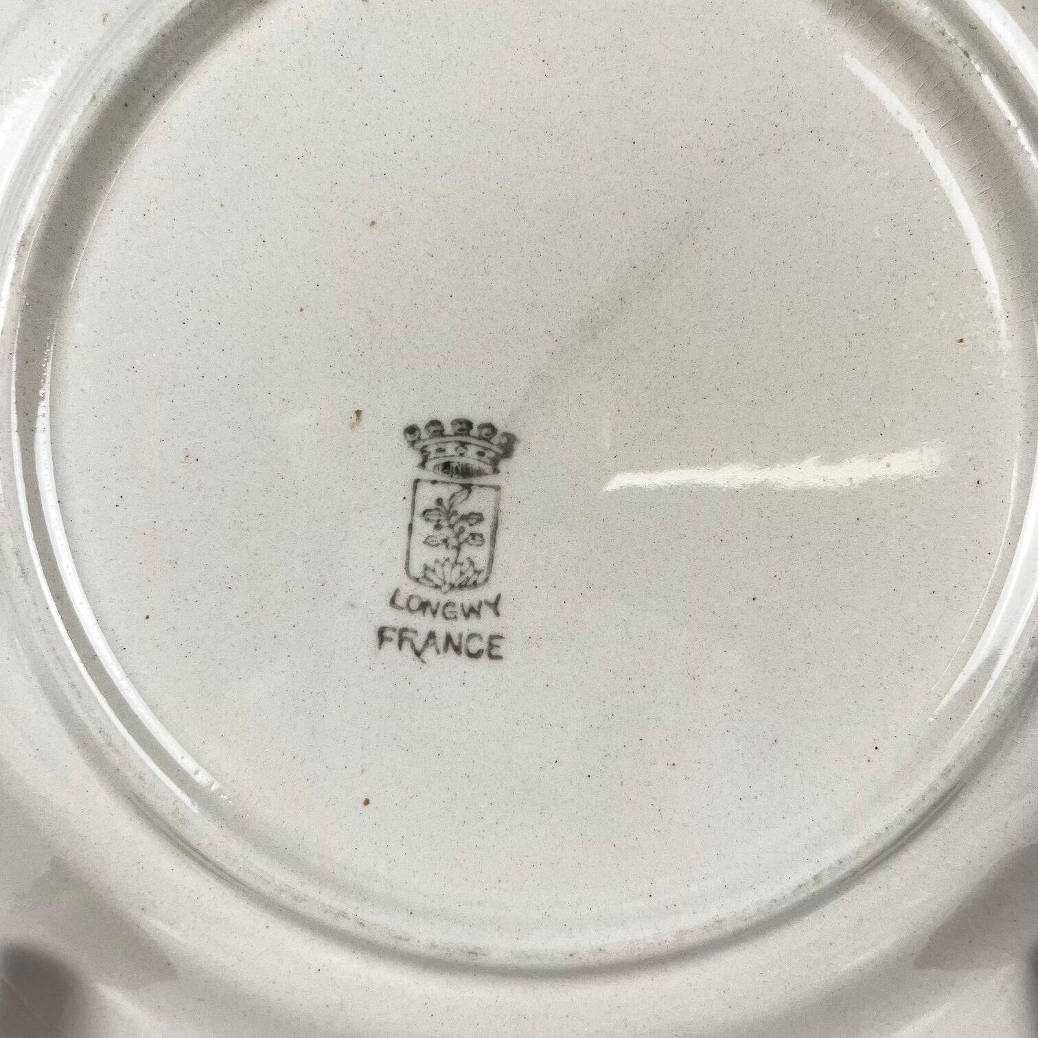 Set of 5 dessert plates Longwy, early 20th century, floral decoration.