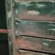 Lot of old green shutters in 4-part iron screen headboard