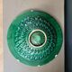 Large pierced earthenware fruit bowl glazed in green and gold.