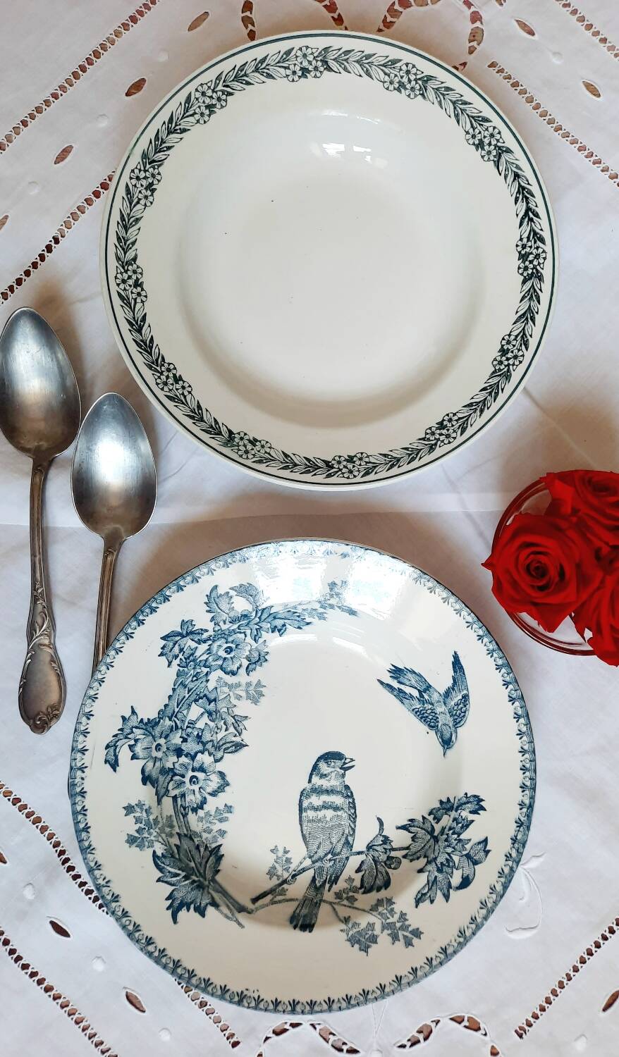 Old mismatched hollow plates in iron earth earthenware accompanied by a soup tureen