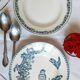 Old mismatched hollow plates in iron earth earthenware accompanied by a soup tureen