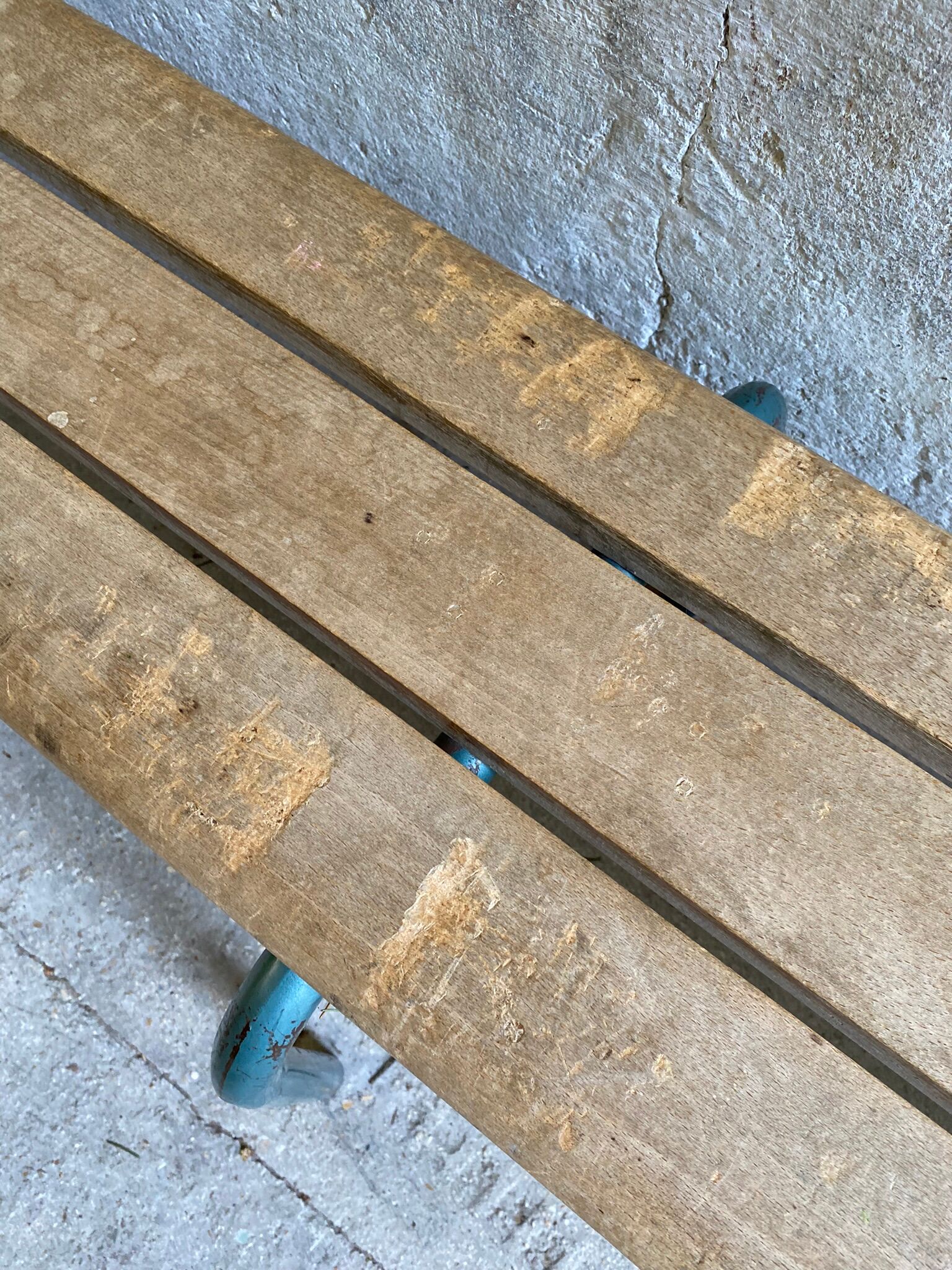 Vintage wood kindergarten bench and tubular structure in long