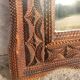 Tramp Art mirror from the 19th century in hand-carved wood.
