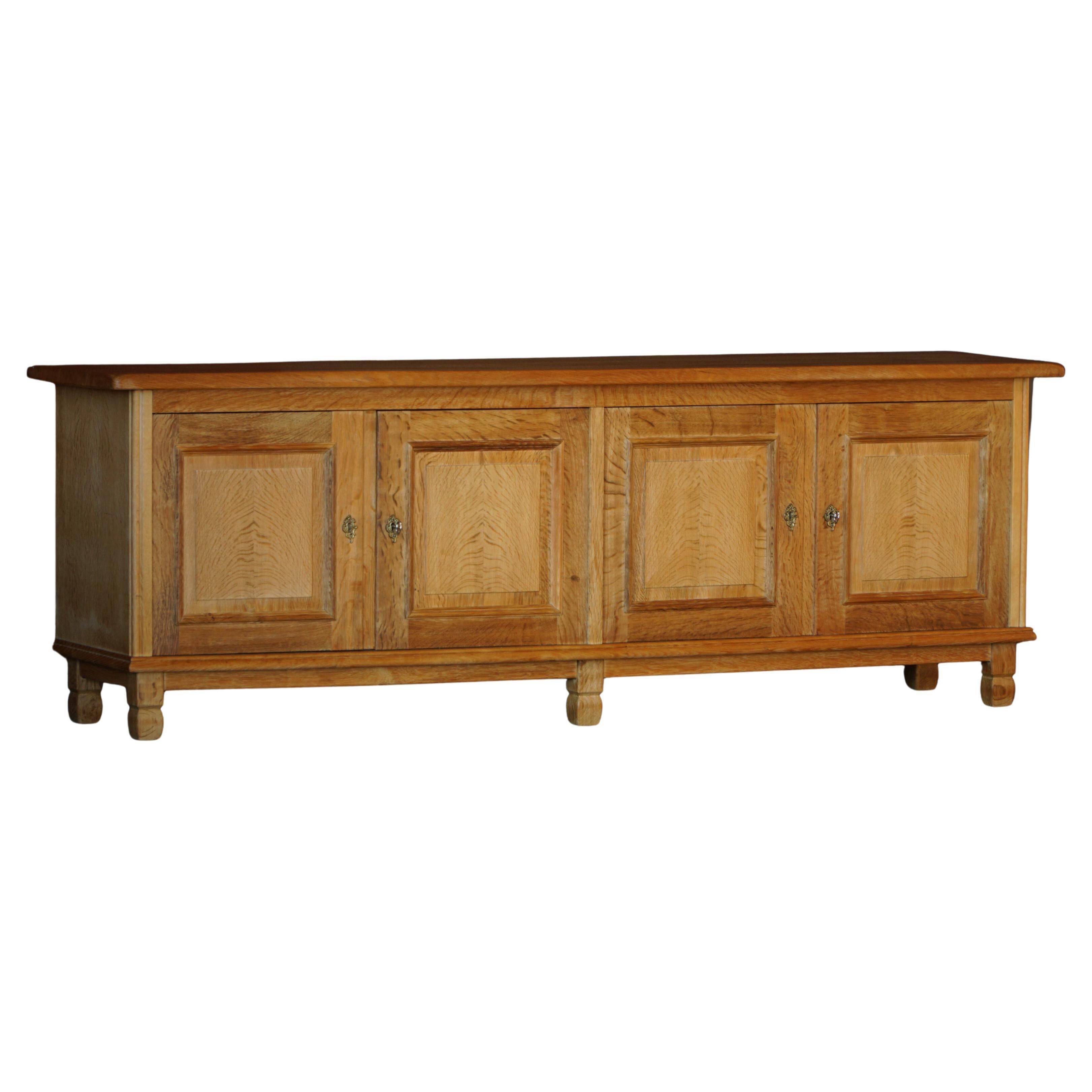 Modern Danish low enfilade in oak with panelled doors, mid-20th century.