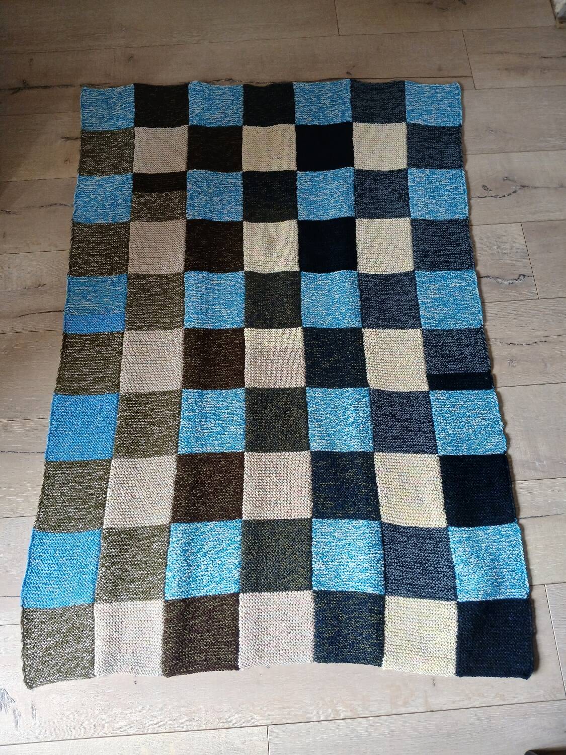 Hand knitted patchwork plaid