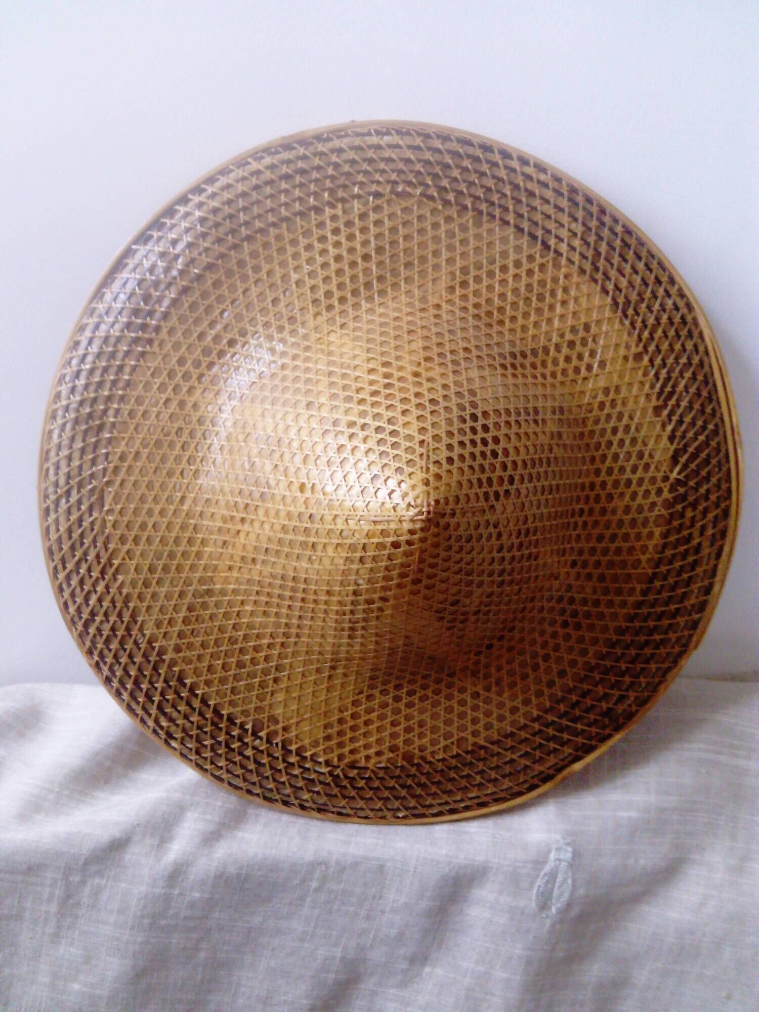 braided Asian hat. palm, bamboo, straw, wicker