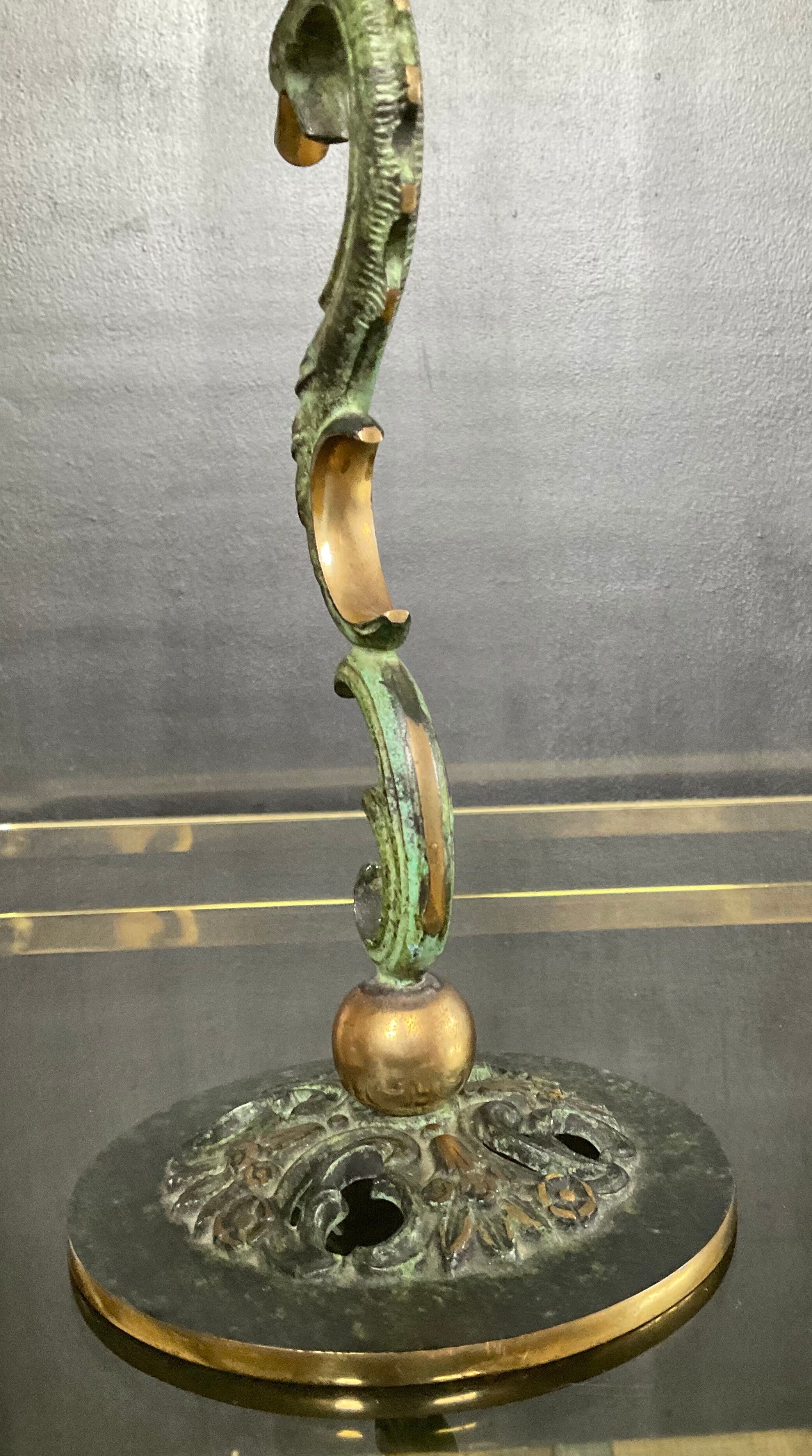 Empire style bronze candlestick with a candle holder