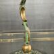 Empire style bronze candlestick with a candle holder