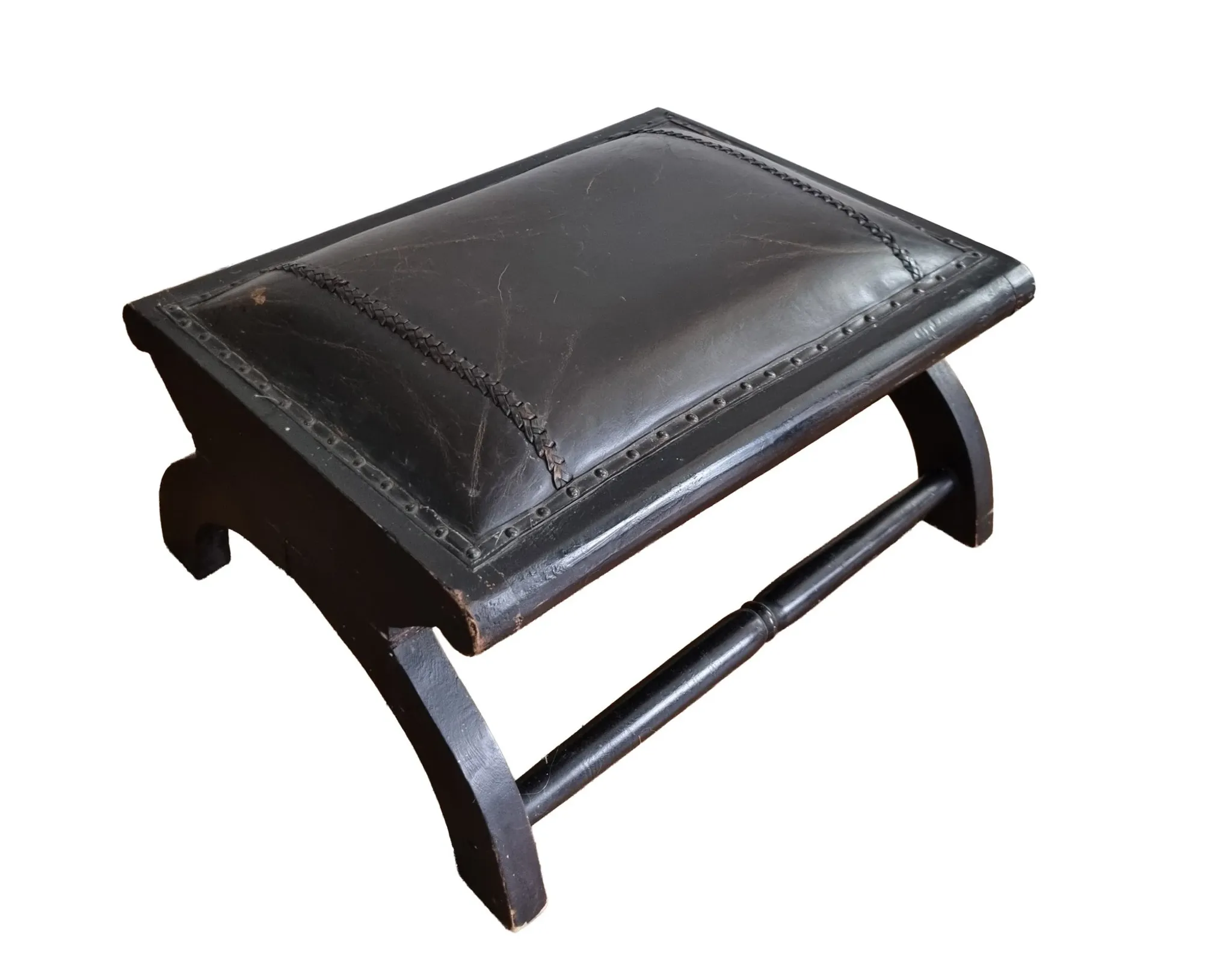 Black leather footstool with curved legs – vintage