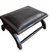 Black leather footstool with curved legs – vintage
