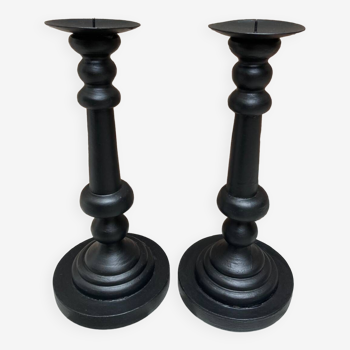 Pair of black wooden candlesticks