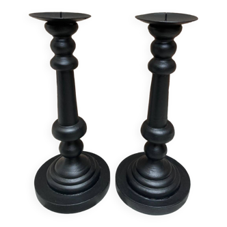 Pair of black wooden candlesticks