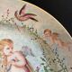 Round earthenware dish - hand decoration signed and marked
