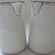 Pair of creamers in white porcelain enhanced with platinum