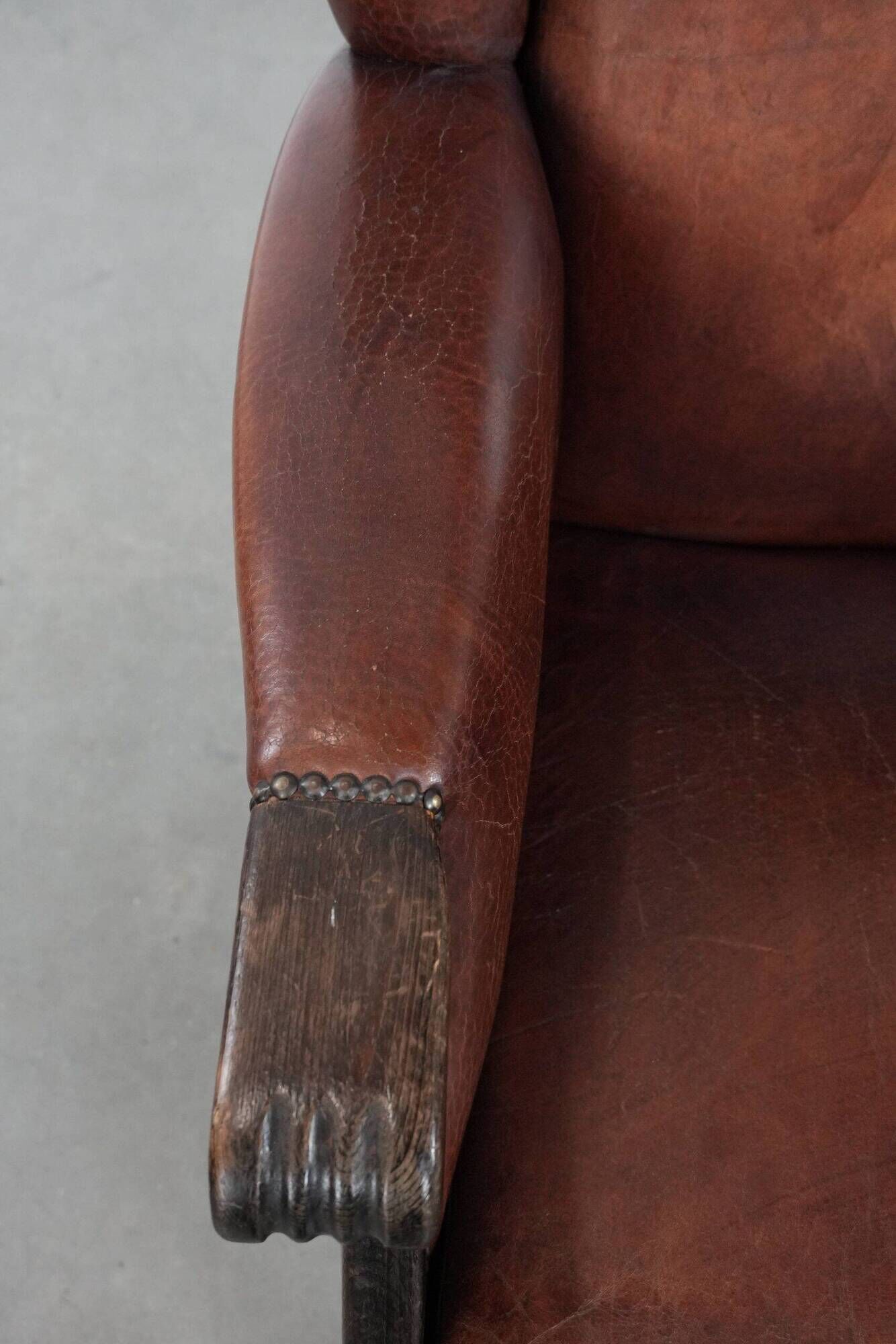 Classic vintage wingback chair in sheepskin and wood