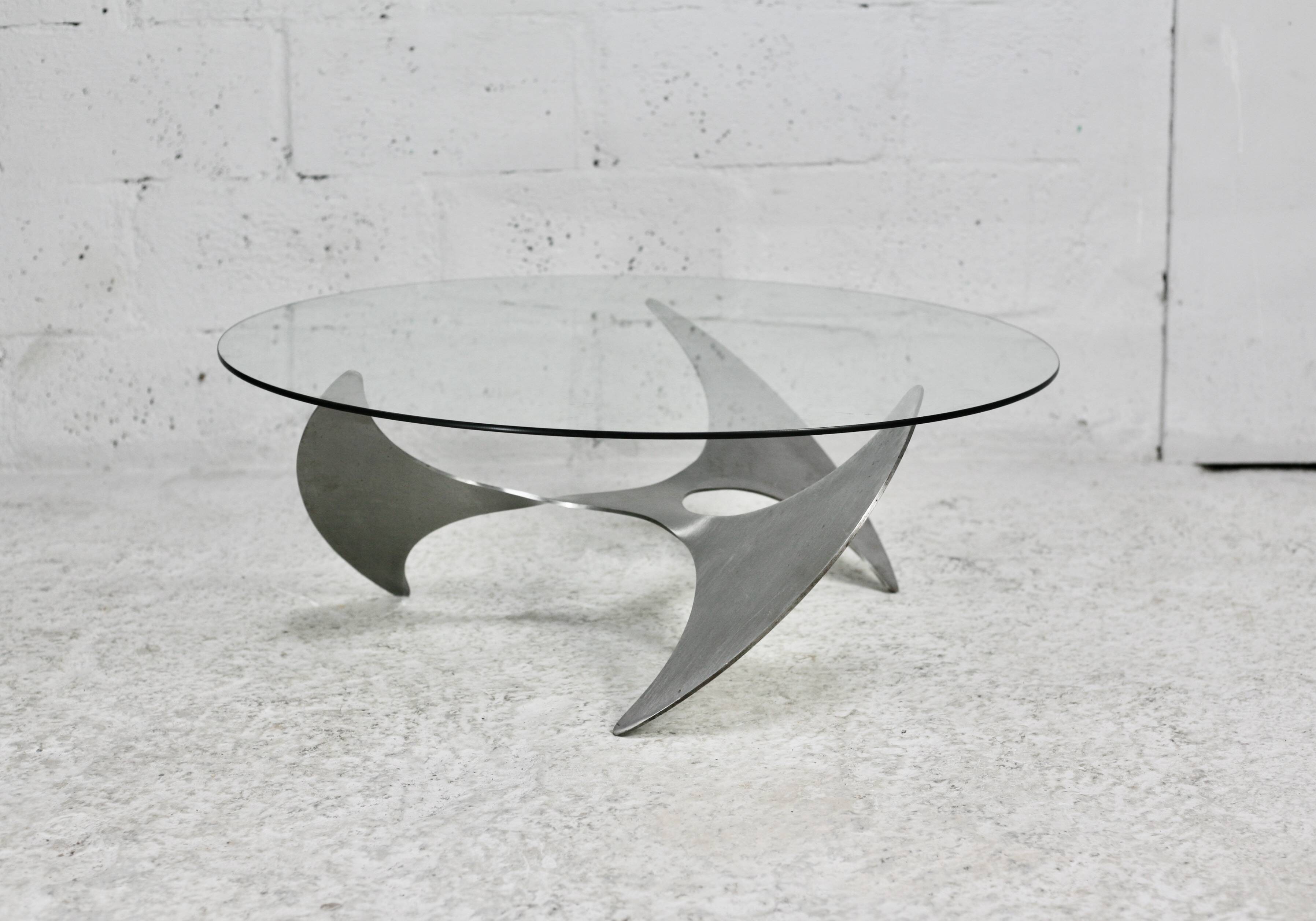 "space age" coffee table. Steel legs, glass slab. Circa 1970