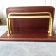 Letter holder covered in leather and golden metal by roche design