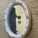 Vintage oval mirror in glazed earthenware