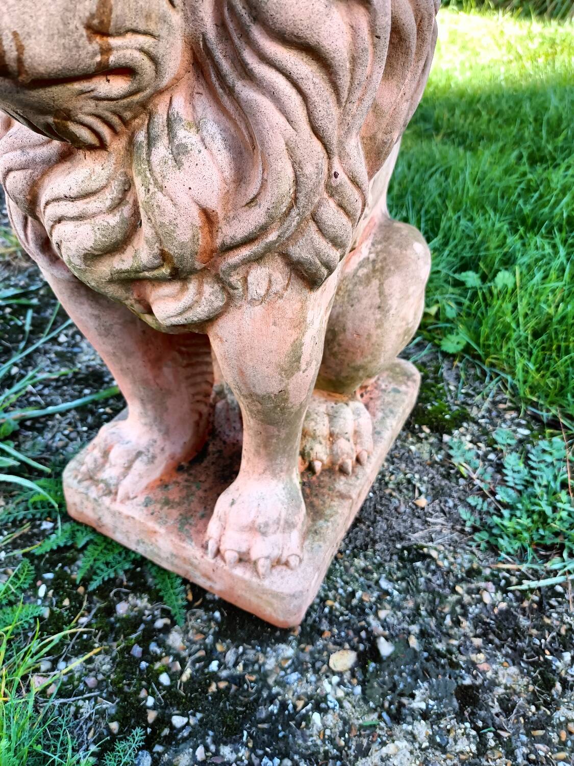 Pair of old terracotta garden lions