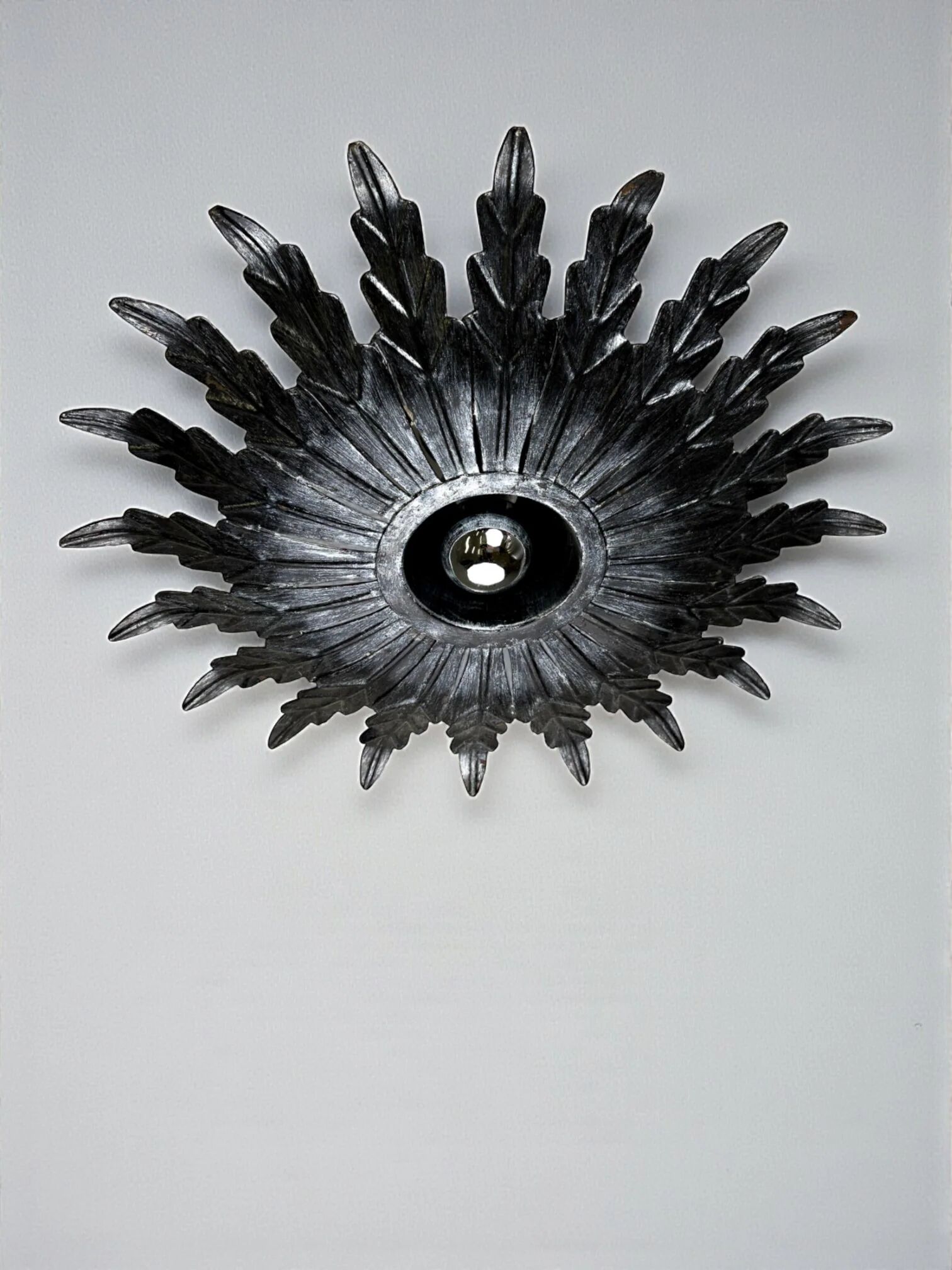 Spanish sunburst ceiling light – dark gilt metal rays, 1950s