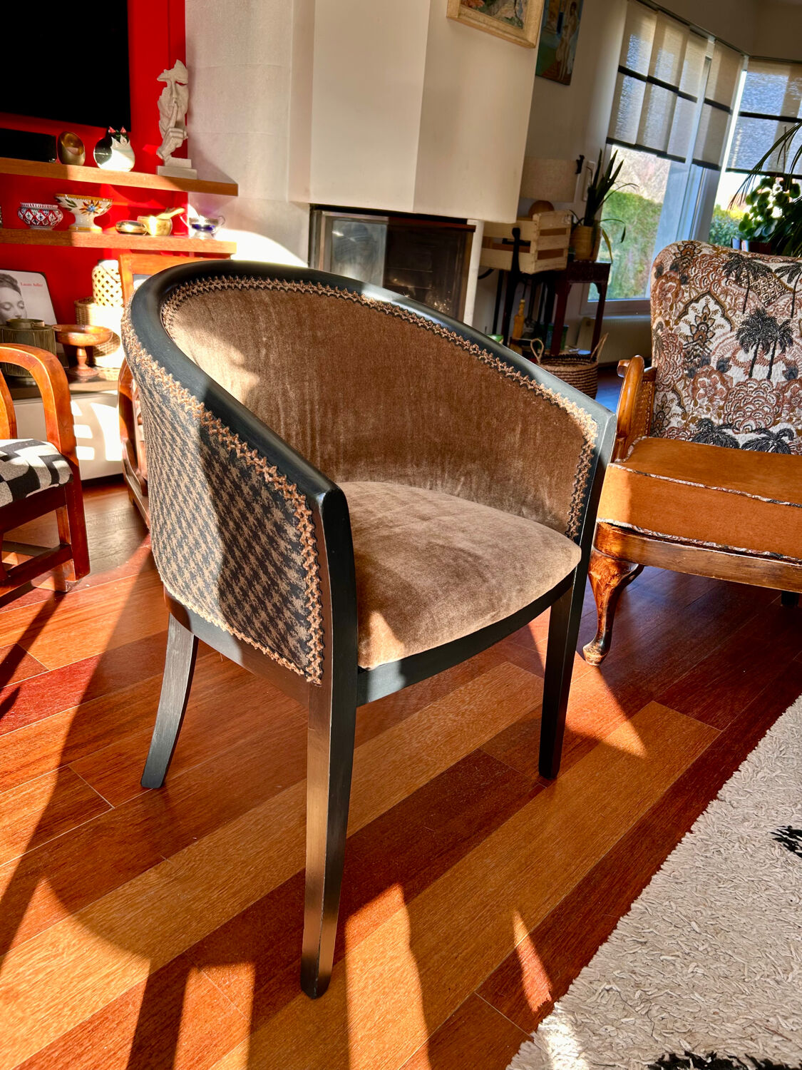 Pair of Art Deco barrel chairs in black and bronze