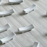 12 chopstick rests, white porcelain knife rests.
