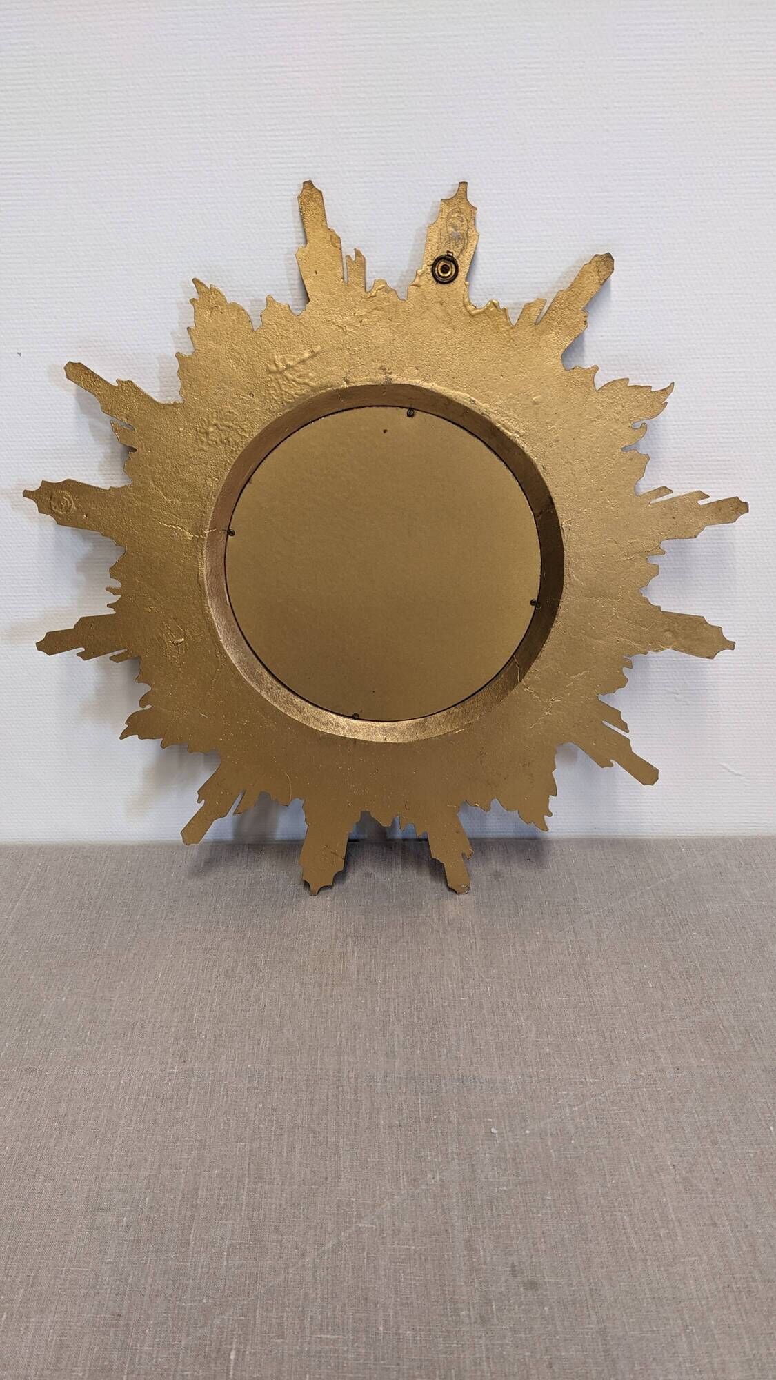 Gold metal sun mirror and witch's eye XL, Italy circa 1970.