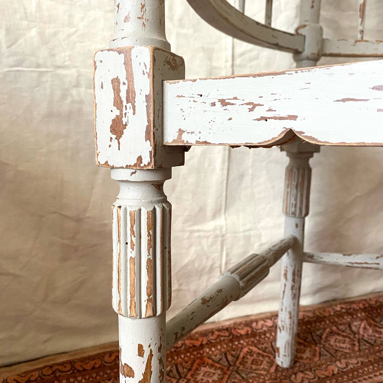 19th-century corner fireplace armchair, wood and cane.