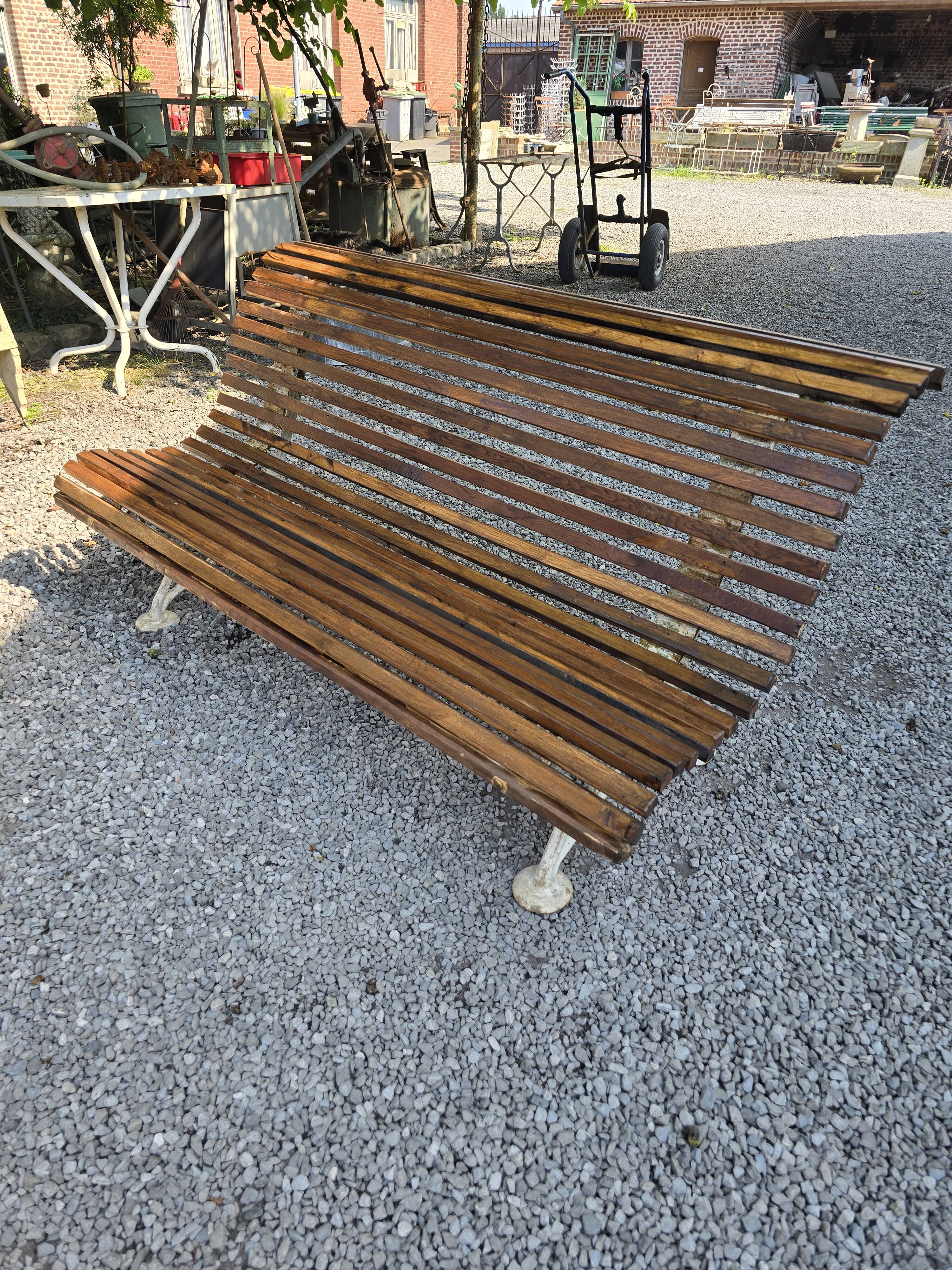Garden bench with cast iron legs and oak slats
