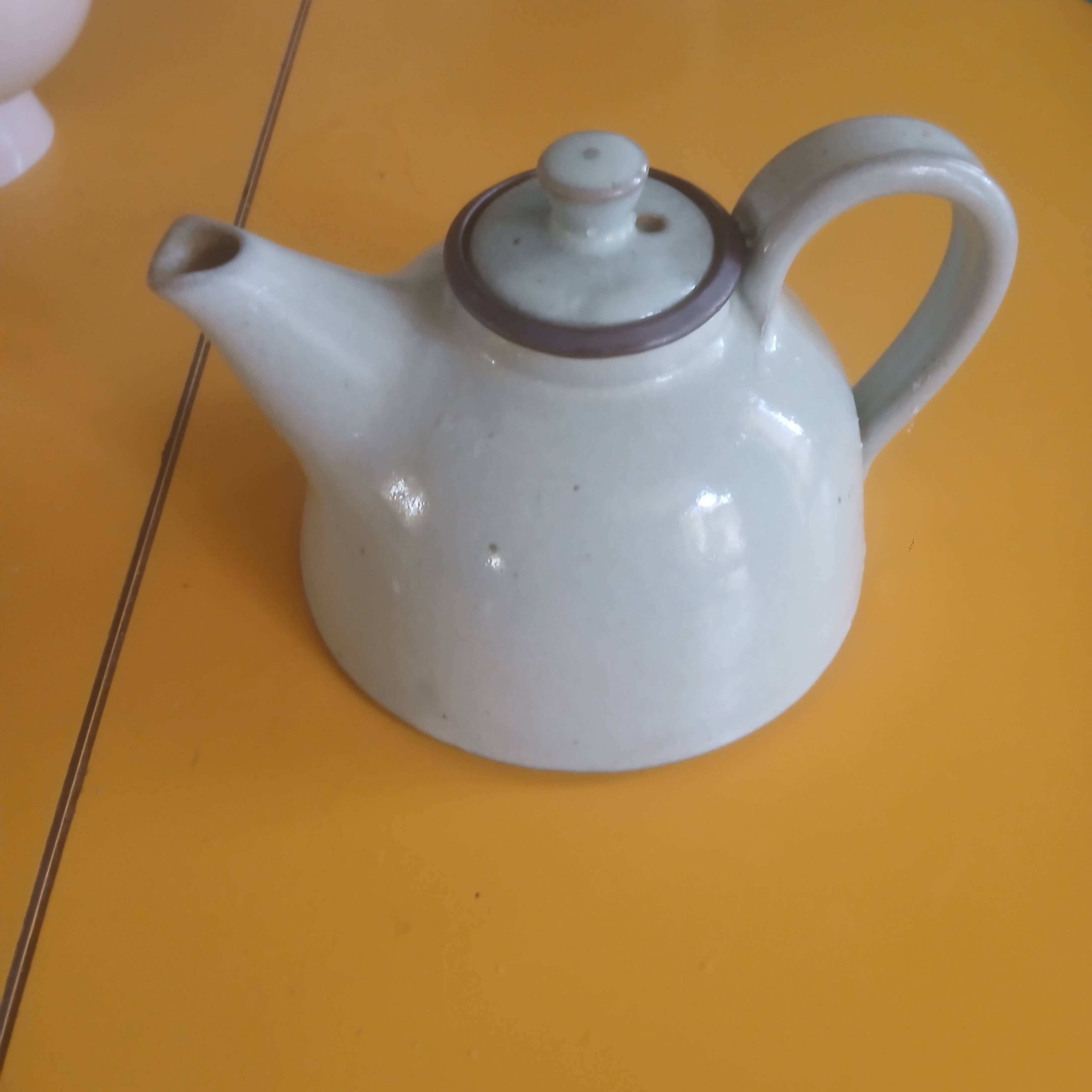 Vintage artisanal style glazed pottery teapot