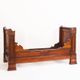 Bed made of solid walnut with marquetry details. France, 1930s.
