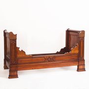 Bed made of solid walnut with marquetry details. France, 1930s.