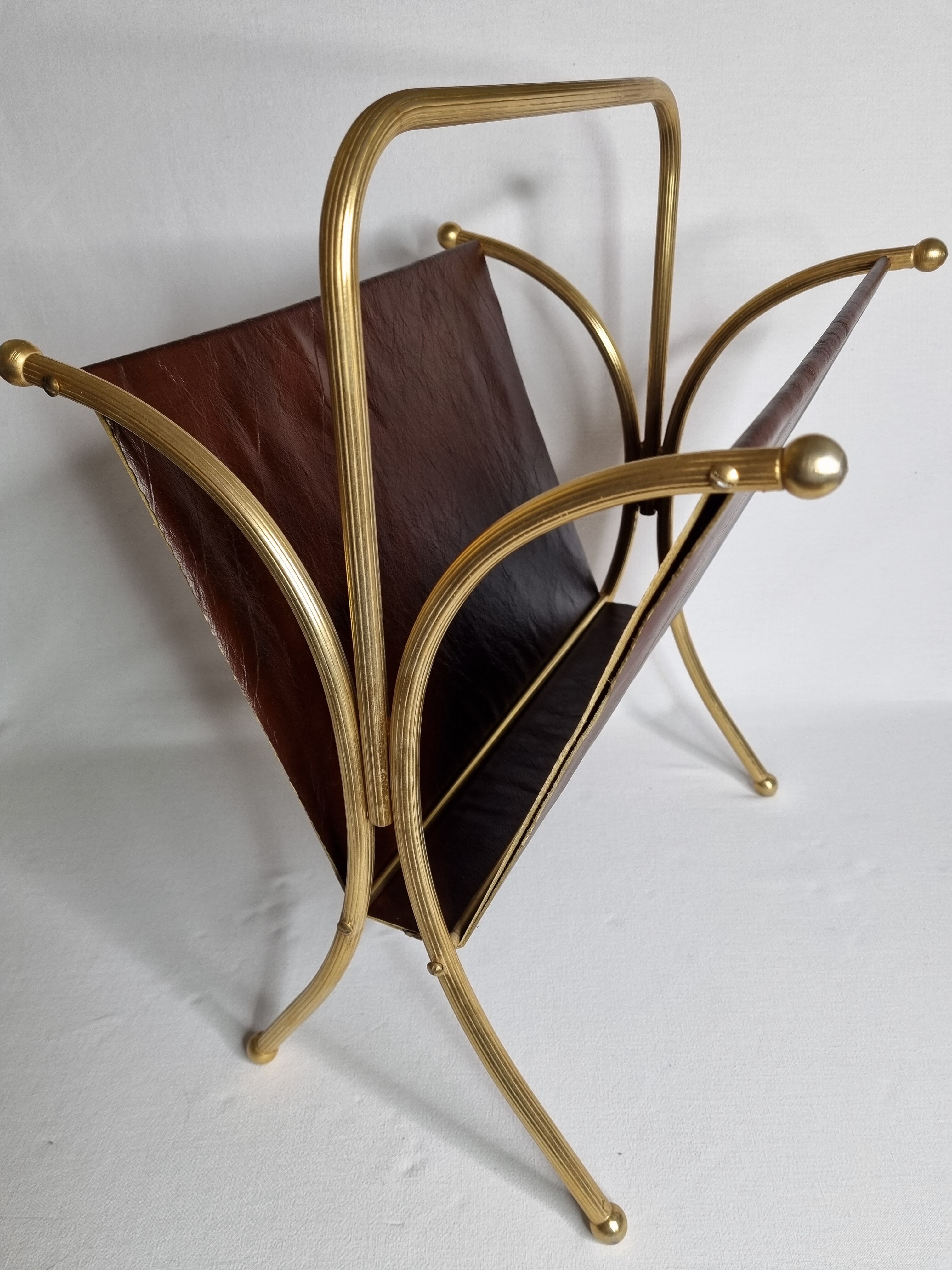 Vintage magazines and gold and leather brass