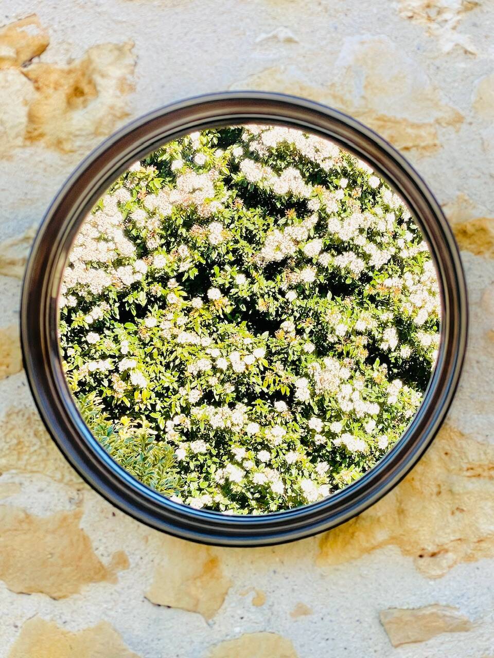 Vintage round smoked plastic mirror, circa 1970s.