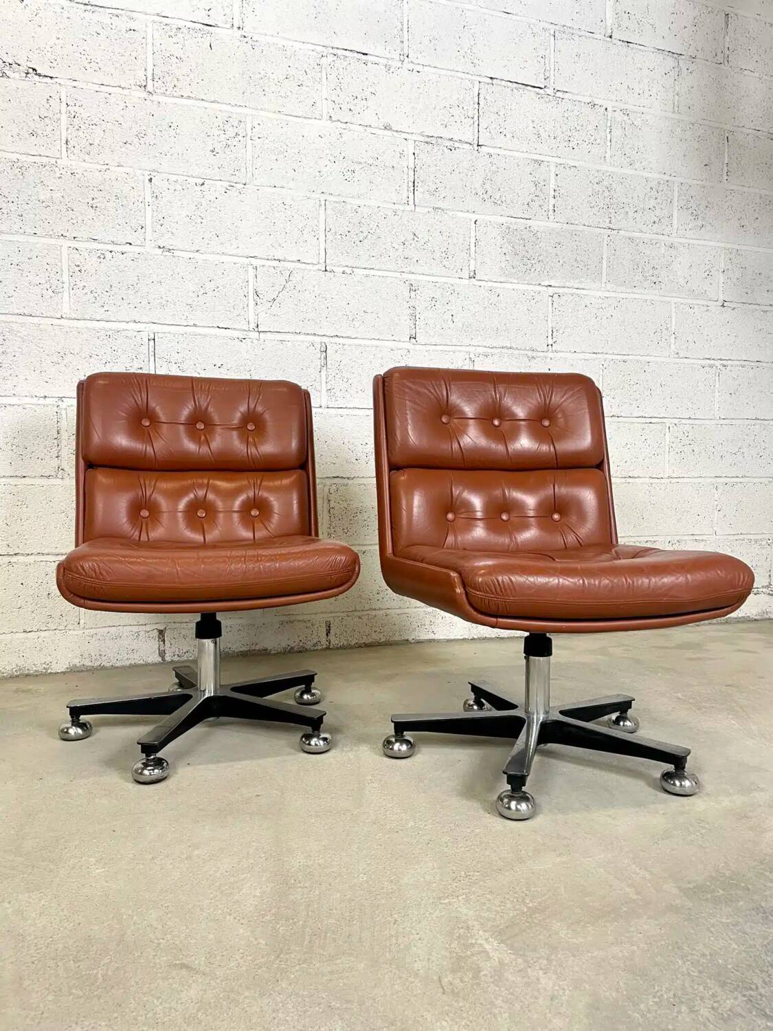 Pair of brown leather armchairs 1980