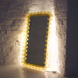 Large luminous acrylic mirror.