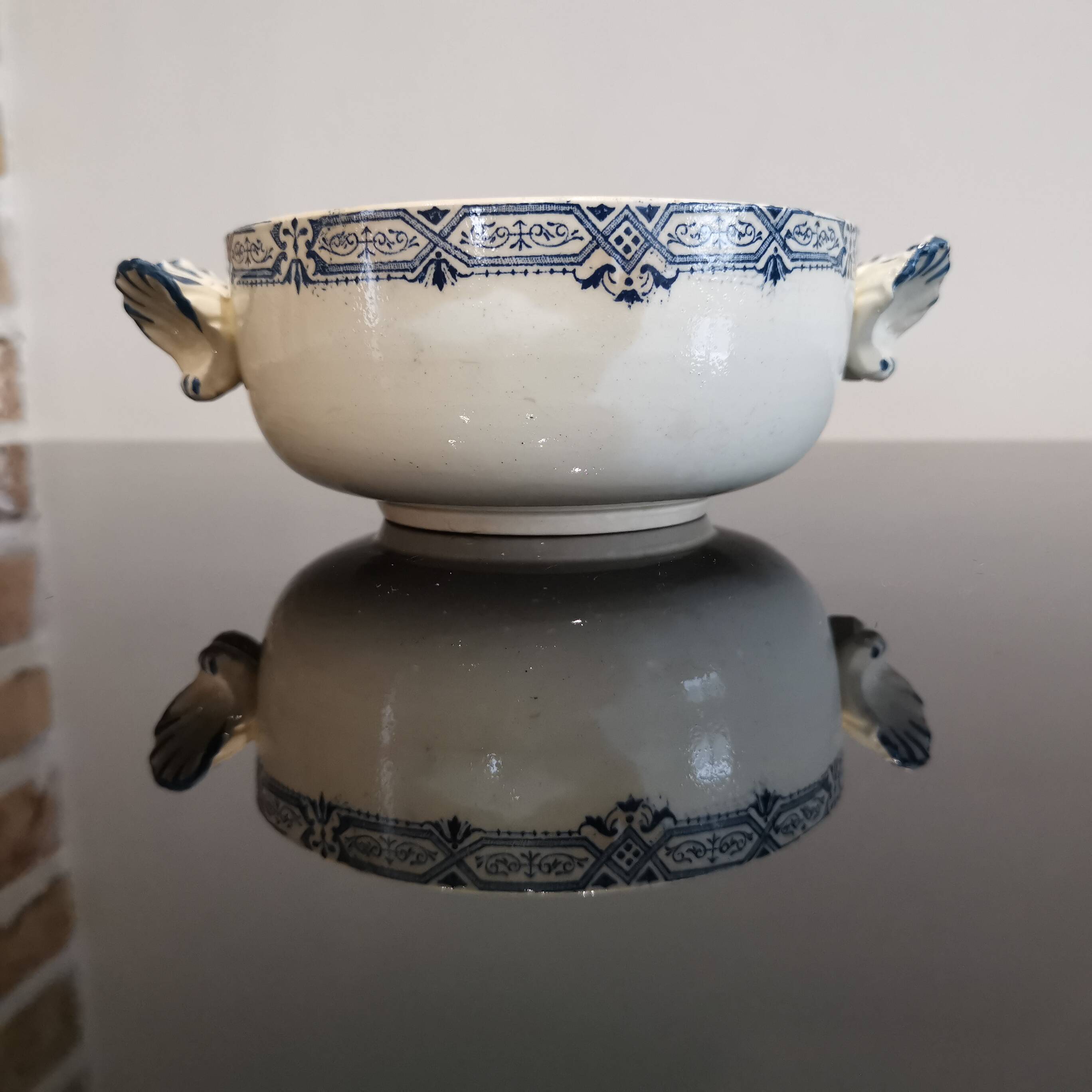 Butterfly ear bowl in iron clay with blue patterns