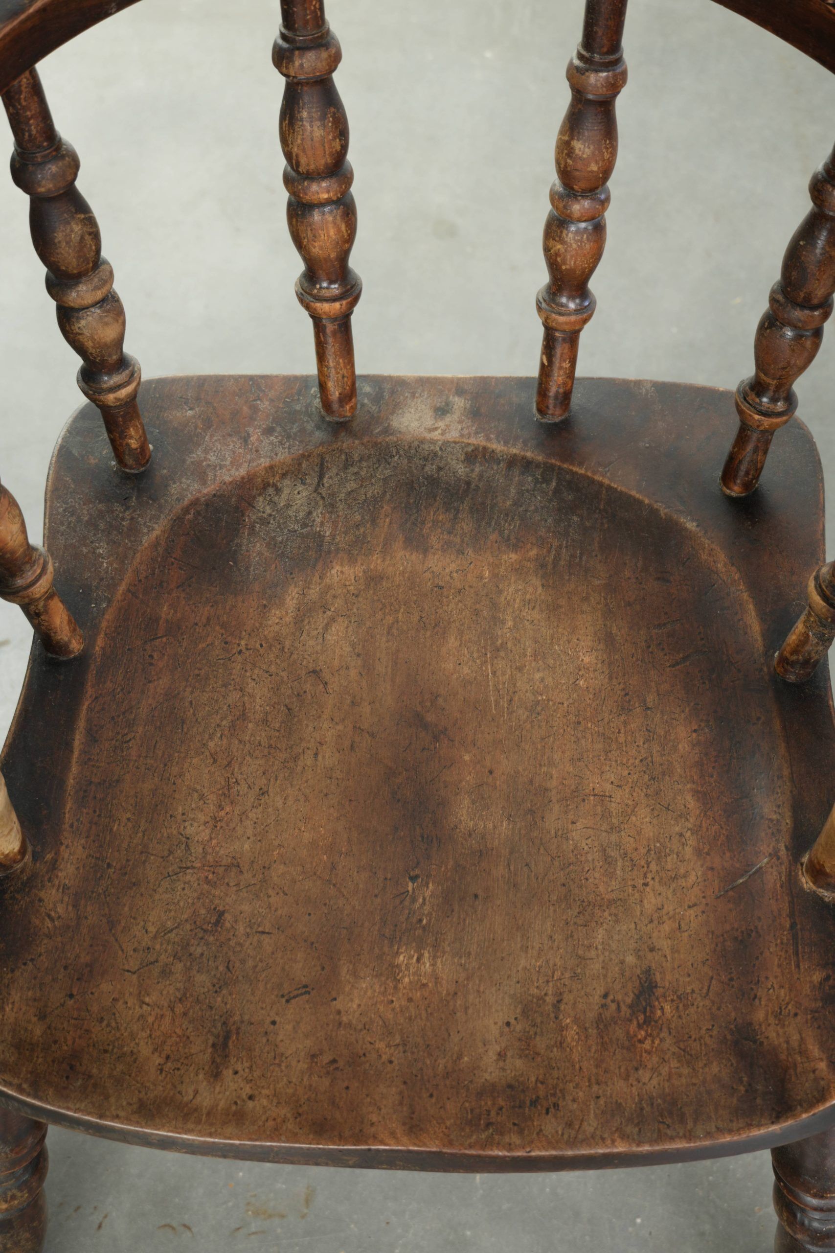 Set of four wooden English antique pub/captain chairs from the 19th century