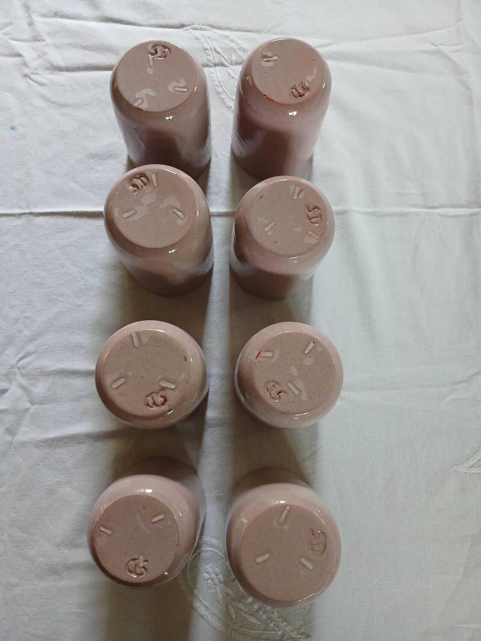 8 signed enamelled ceramic mugs