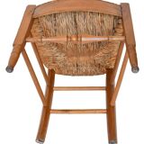 Pair of chairs with slatted backs and painted bands depicting animated landscapes.