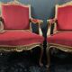 Pair of flat-back armchairs in Louis XV style in red velvet.