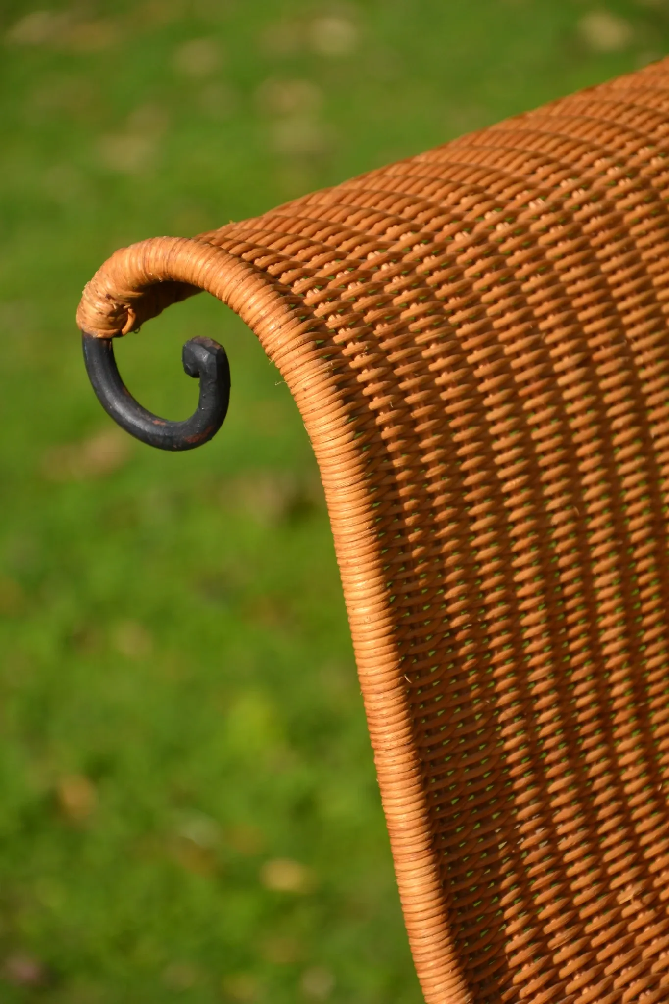 Wrought iron and rattan magazine/newspaper rack