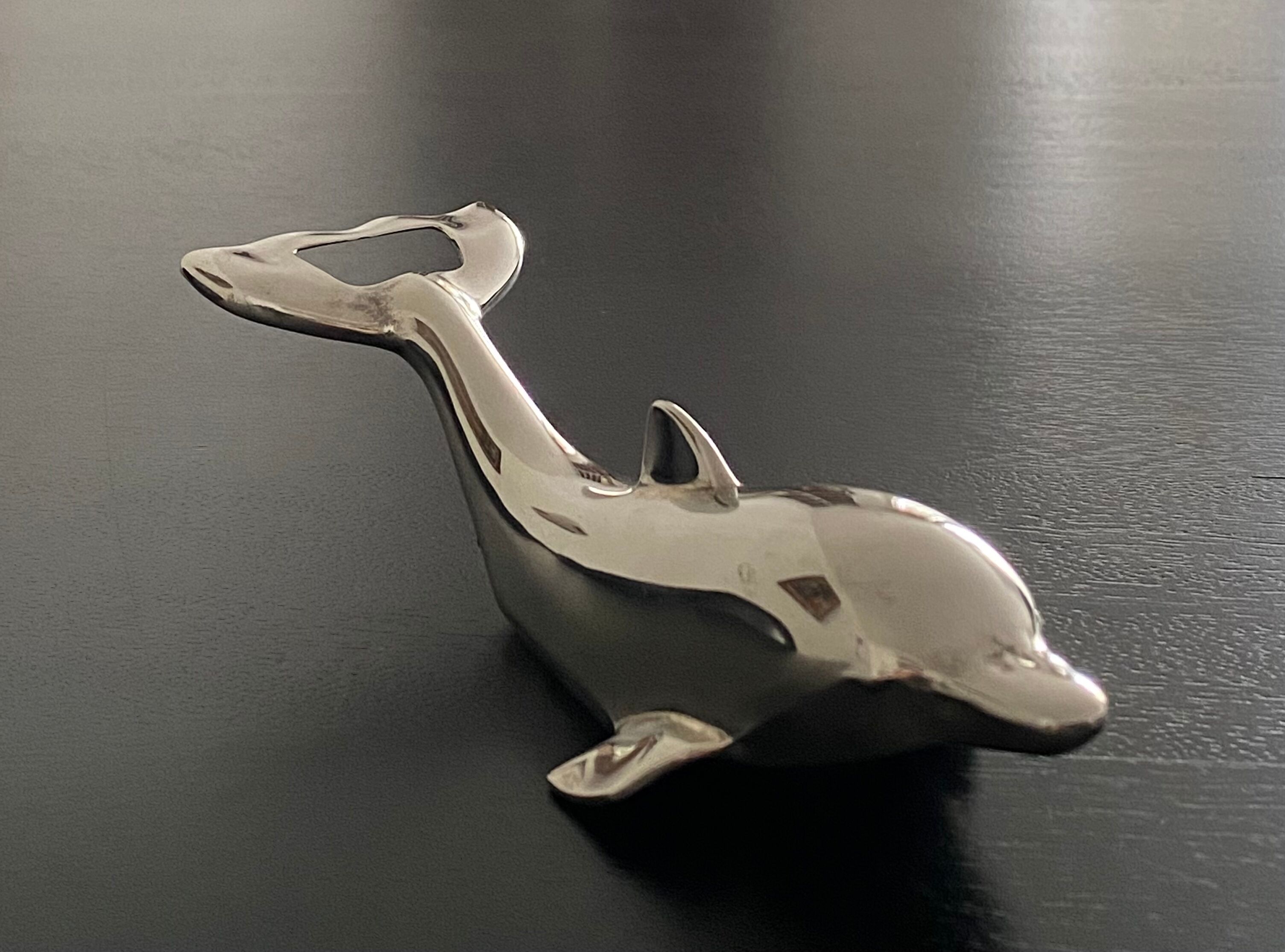 Bottle opener dolphin shape