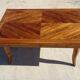 Antique solid walnut table with marquetry and extensions.