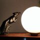 Lampe art déco marbre globe opaline et lévriers en régule, 1930
