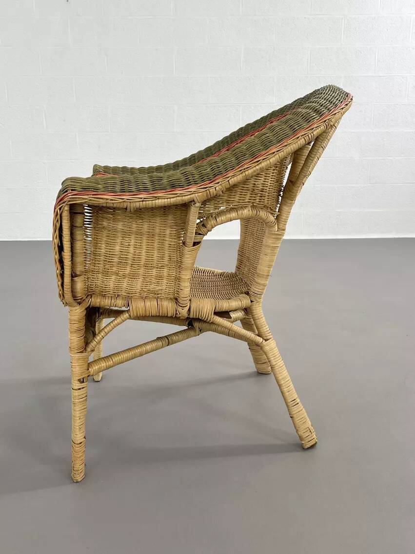 Rattan, wicker and green and red edging cabriolet style armchair
