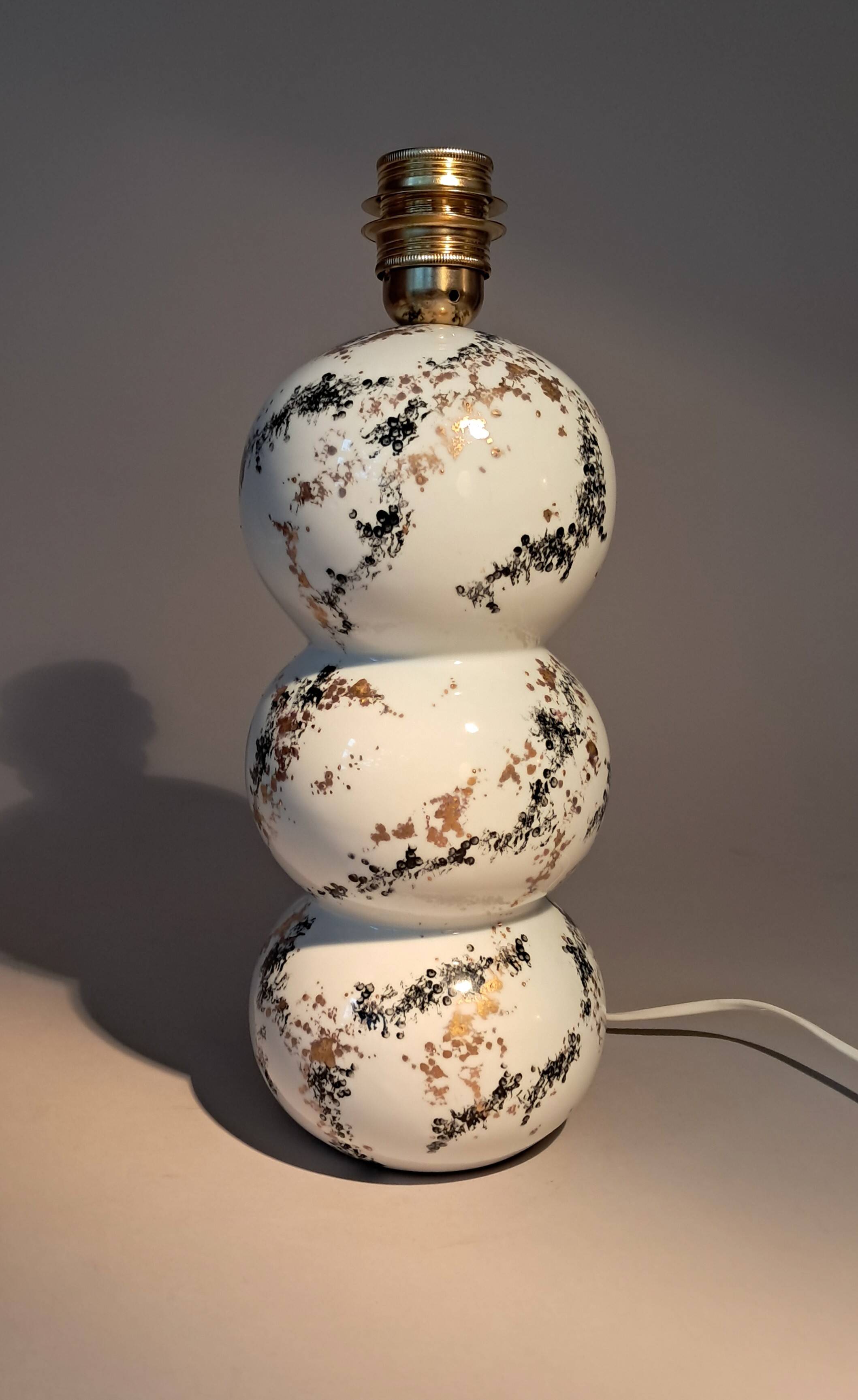 Fine porcelain lamp painted and gilded with fine gold. Laure Selignac, Paris.