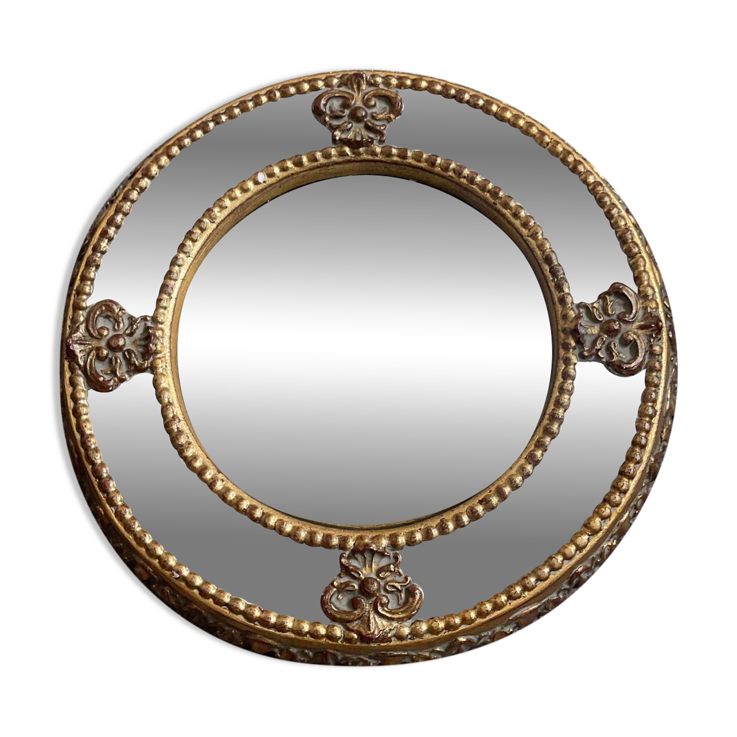 Antique domed witch's eye mirror in gilded wood