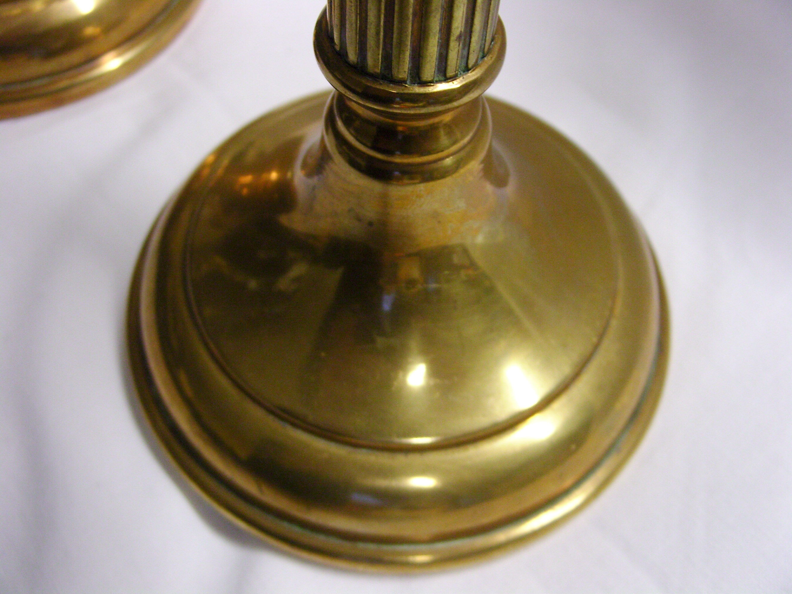 Pair of fluted brass candlesticks Louis XVI style